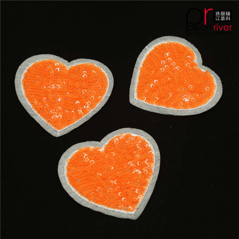 Oranje paillettenpatch in hartvorm