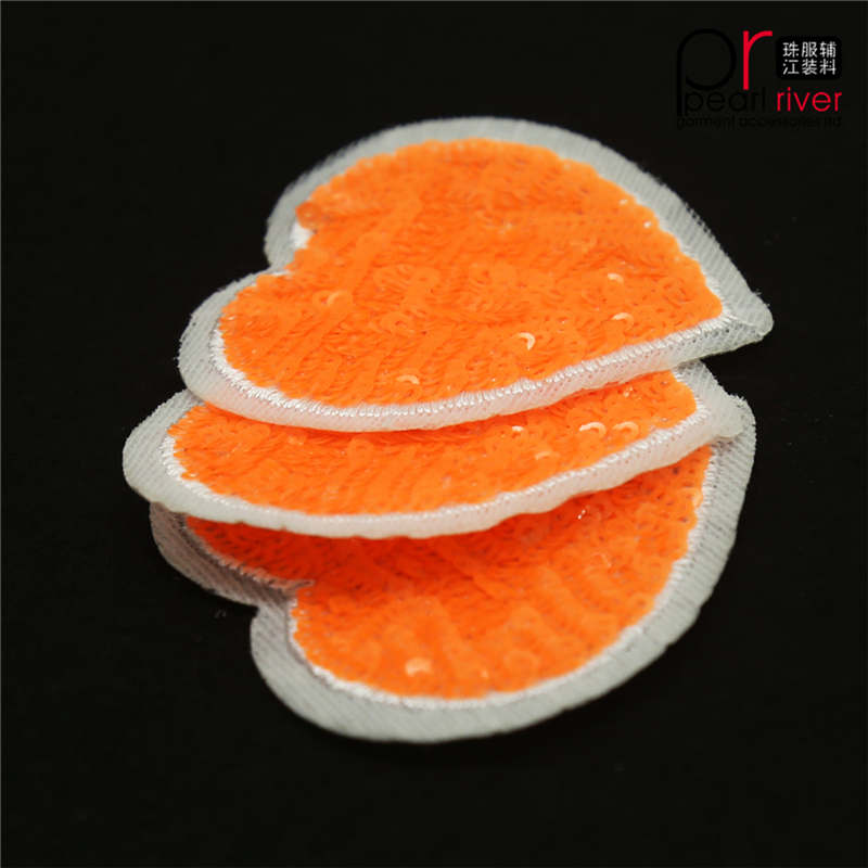 Oranje paillettenpatch in hartvorm