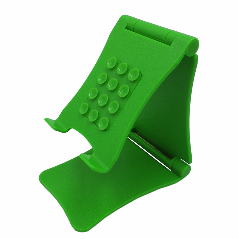 Groene verstelbare opvouwbare siliconen telefoonhouder